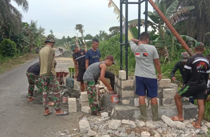 Satgas Raider 300 Membuat Tugu Selamat Datang Di Kampung Yanemyo